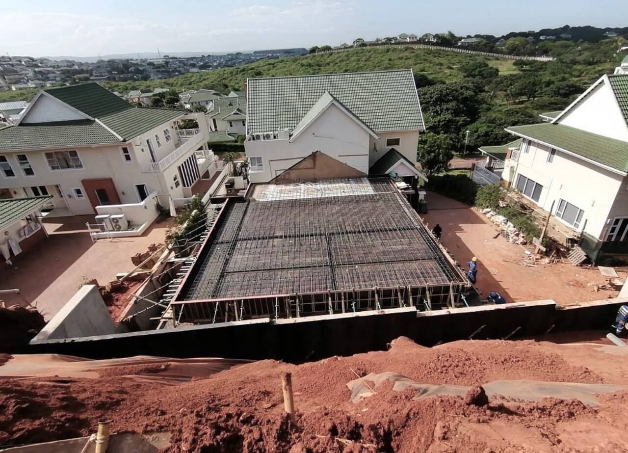 Residential coastal home with reinforced slab construction overlooking the sea