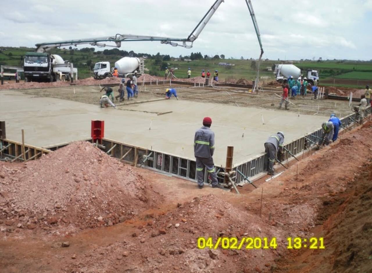 Concrete pour in progress on a large ground slab